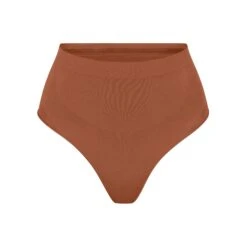 SEAMLESS SCULPT MID WAIST THONG | BRONZE