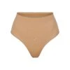 SEAMLESS SCULPT MID WAIST THONG | OCHRE