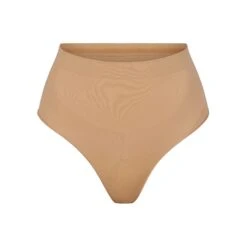 SEAMLESS SCULPT MID WAIST THONG | OCHRE