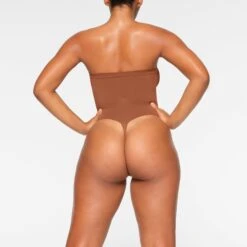 SEAMLESS SCULPT STRAPLESS THONG BODYSUIT | BRONZE 11 SEAMLESS SCULPT STRAPLESS THONG BODYSUIT | BRONZE -SWIMwear Sale Store SKIMS SHAPEWEAR BD THG 2913 IA BRZ 0017 BK