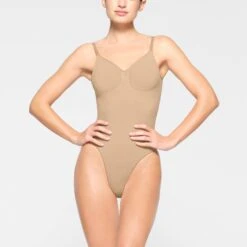 SEAMLESS SCULPT LOW BACK THONG BODYSUIT | CLAY 10 SEAMLESS SCULPT LOW BACK THONG BODYSUIT | CLAY -SWIMwear Sale Store SKIMS SHAPEWEAR BD THG 3371 KD CLY 0003 FR