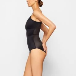 BARELY THERE BODYSUIT BRIEF W/ SNAPS | ONYX 10 BARELY THERE BODYSUIT BRIEF W/ SNAPS | ONYX -SWIMwear Sale Store SKIMS SHAPEWEAR SH BSB 1641 NB ONX SD