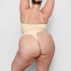SEAMLESS SCULPT MID WAIST THONG | SAND -SWIMwear Sale Store SKIMS SHAPEWEAR SH MWT 0198 BB SND BK a7db05de 8988 4545 9c56 1fbe0177c0e1