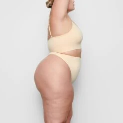 SEAMLESS SCULPT MID WAIST THONG | SAND -SWIMwear Sale Store SKIMS SHAPEWEAR SH MWT 0198 BB SND SD 518fae52 7d75 4dcd af6e e43f7f9dea99